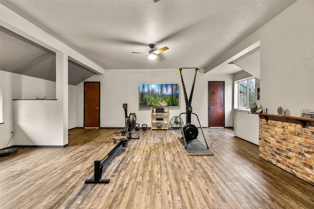 630 Tally Lake Rd, Whitefish, MT 59937 - exercise room with wood finished floors, a ceiling fan, and vaulted ceiling