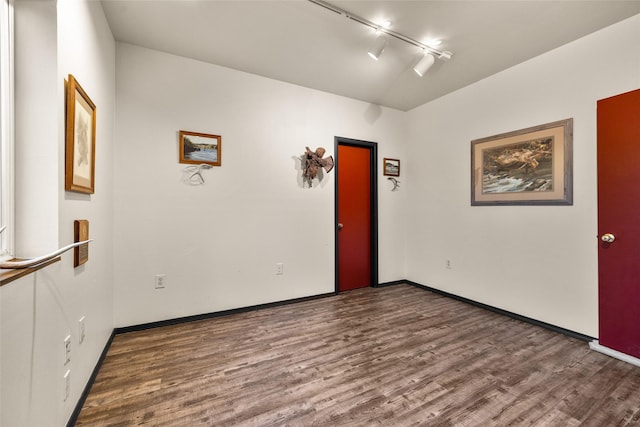 630 Tally Lake Rd, Whitefish, MT 59937 - empty room featuring wood finished floors and rail lighting