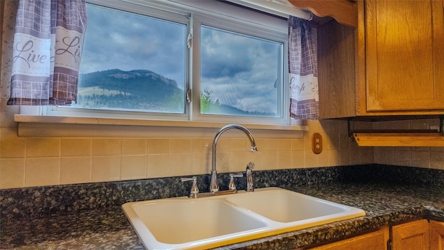 1220 Cannon St, Helena, MT 59601 - kitchen view of backsplash and brown cabinetry