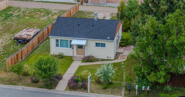 1220 Cannon St, Helena, MT 59601 - view of front facade with a fenced backyard and a shingled roof