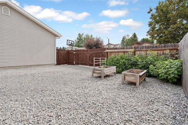 301 Buttercup Loop, Kalispell, MT 59901 - fenced backyard featuring a garden