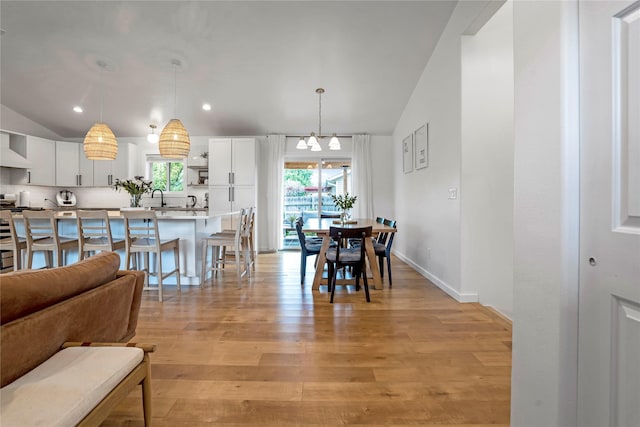 301 Buttercup Loop, Kalispell, MT 59901 - dining area featuring healthy amount of natural light, light wood-style flooring, lofted ceiling, and recessed lighting