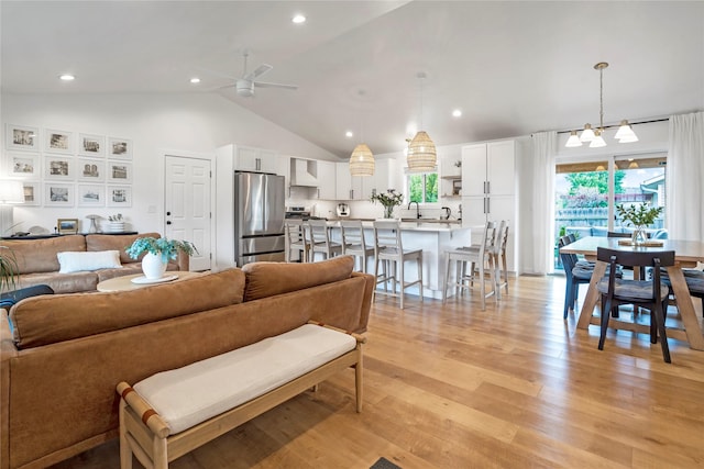 301 Buttercup Loop, Kalispell, MT 59901 - living room featuring a ceiling fan, vaulted ceiling, light wood-style floors, and recessed lighting