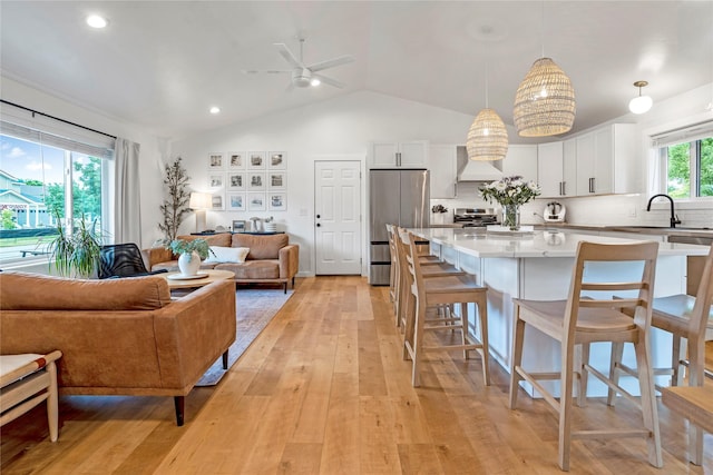 301 Buttercup Loop, Kalispell, MT 59901 - living area featuring ceiling fan, light wood finished floors, lofted ceiling, and recessed lighting