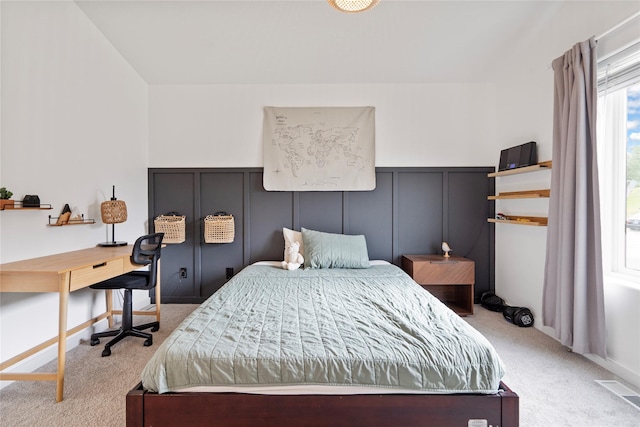 301 Buttercup Loop, Kalispell, MT 59901 - bedroom featuring carpet flooring, a decorative wall, a desk, and a wainscoted wall