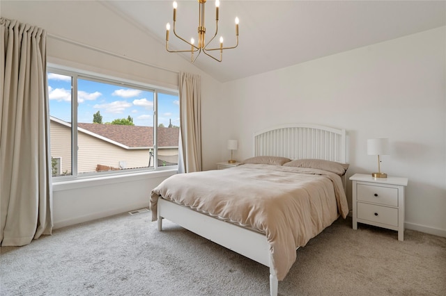 301 Buttercup Loop, Kalispell, MT 59901 - carpeted bedroom with a chandelier and vaulted ceiling