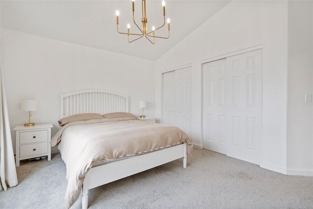 301 Buttercup Loop, Kalispell, MT 59901 - bedroom with multiple closets, a chandelier, carpet floors, and vaulted ceiling