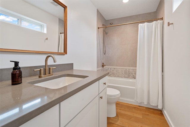 301 Buttercup Loop, Kalispell, MT 59901 - bathroom featuring vanity, shower / tub combo, wood finished floors, and recessed lighting