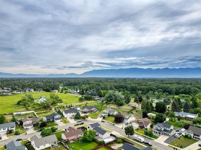 301 Buttercup Loop, Kalispell, MT 59901 - aerial view of property and surrounding area featuring a mountainous background and nearby suburban area