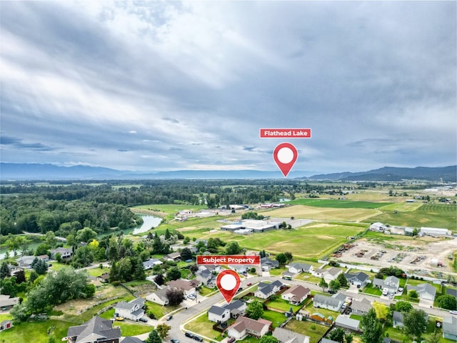 301 Buttercup Loop, Kalispell, MT 59901 - aerial view of property and surrounding area featuring a water and mountain view and nearby suburban area