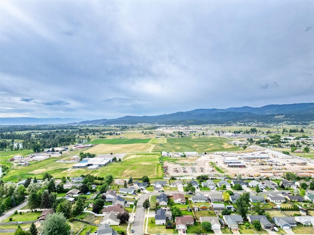 301 Buttercup Loop, Kalispell, MT 59901 - aerial overview of property's location featuring mountains and nearby suburban area