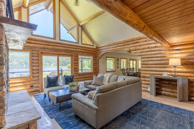2755 US Highway 93 W, Whitefish, MT 59937 - living area with high vaulted ceiling, log walls, beamed ceiling, arched walkways, and wood finished floors