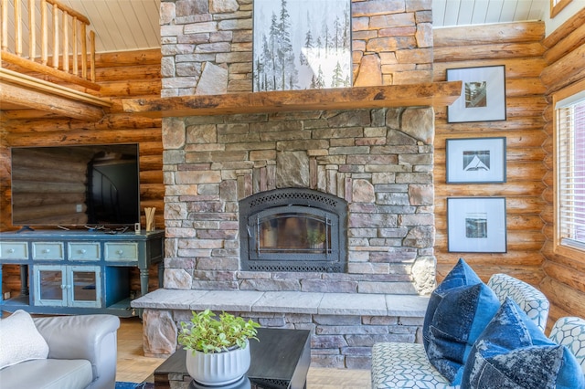 2755 US Highway 93 W, Whitefish, MT 59937 - living area with rustic walls, wood ceiling, wood finished floors, and a stone fireplace