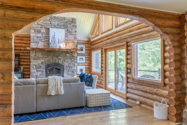 2755 US Highway 93 W, Whitefish, MT 59937 - living room with wood finished floors, a fireplace, and log walls