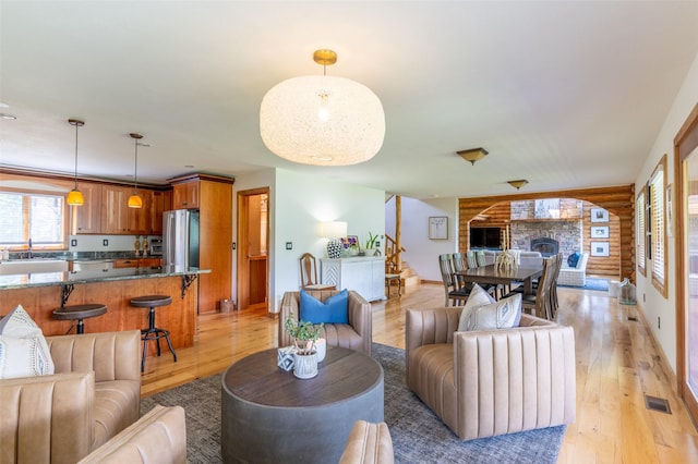 2755 US Highway 93 W, Whitefish, MT 59937 - living room with light wood-style flooring, stairway, and a fireplace with raised hearth