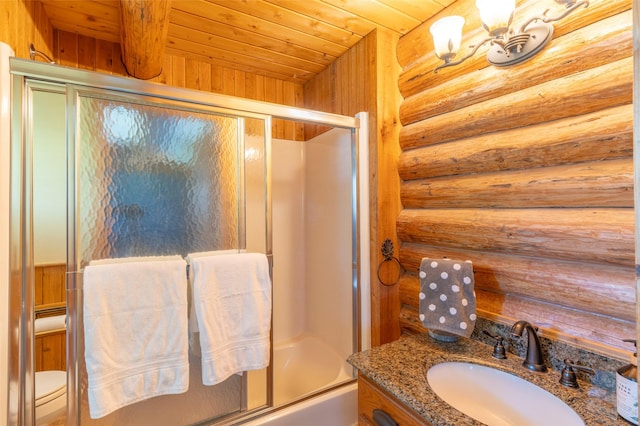 2755 US Highway 93 W, Whitefish, MT 59937 - bathroom featuring rustic walls, enclosed tub / shower combo, vanity, and wood ceiling