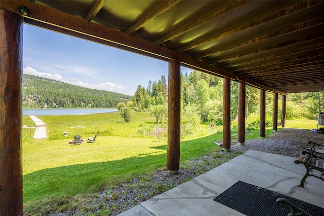 2755 US Highway 93 W, Whitefish, MT 59937 - view of patio featuring a wooded view and a water view