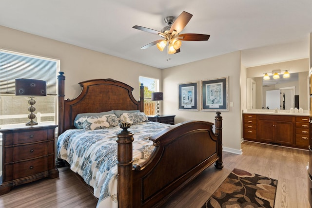 64 Empire Loop, Kalispell, MT 59901 - bedroom featuring wood finished floors, ensuite bathroom, and ceiling fan