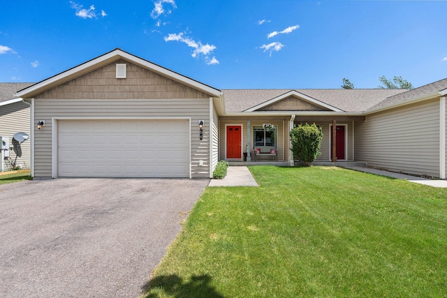 64 Empire Loop, Kalispell, MT 59901 - ranch-style home featuring driveway, a front lawn, an attached garage, covered porch, and a shingled roof