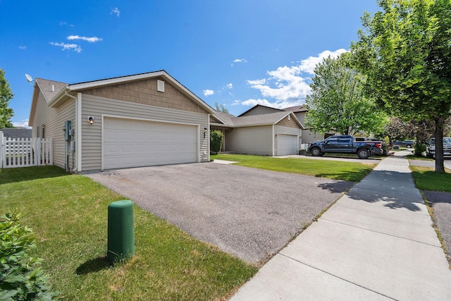 64 Empire Loop, Kalispell, MT 59901 - ranch-style home with an attached garage and driveway