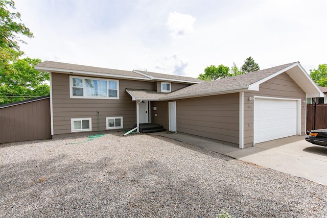 504 N 19th Ave, Bozeman, MT 59718 - split level home featuring concrete driveway and a shingled roof