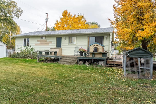 609 11th Ave E, Polson, MT 59860 - back of property with a wooden deck and an outdoor structure