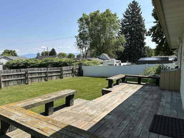 609 11th Ave E, Polson, MT 59860 - wooden terrace with a fenced backyard