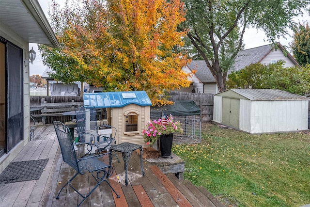 609 11th Ave E, Polson, MT 59860 - wooden terrace with a storage unit and a fenced backyard