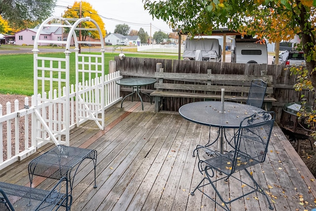 609 11th Ave E, Polson, MT 59860 - wooden terrace with outdoor dining area