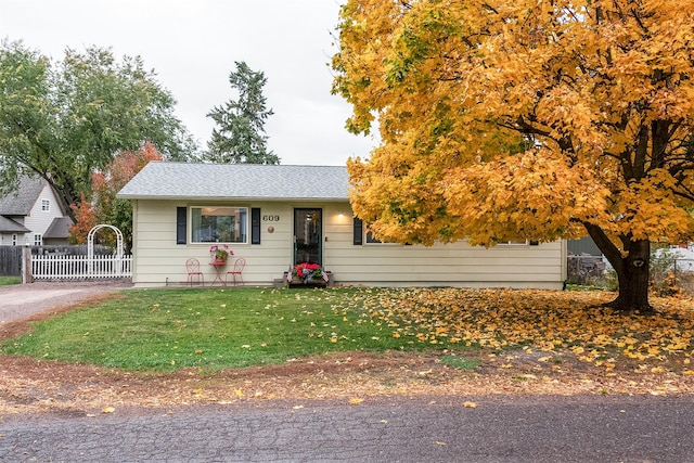 609 11th Ave E, Polson, MT 59860 - view of front facade with a shingled roof