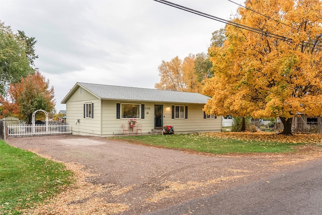609 11th Ave E, Polson, MT 59860 - ranch-style house featuring a shingled roof