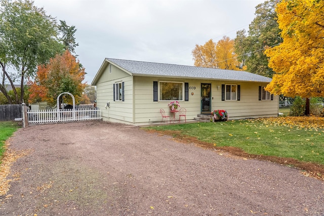 609 11th Ave E, Polson, MT 59860 - ranch-style house with roof with shingles