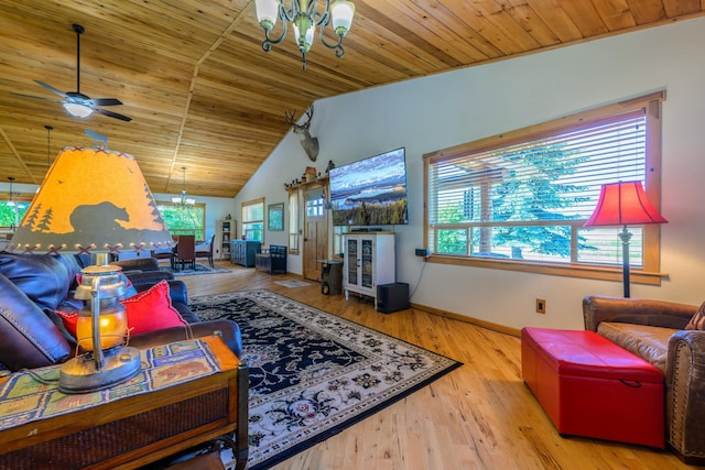 192 Leonard Ln, Eureka, MT 59917 - living room with a chandelier, wooden ceiling, vaulted ceiling, a ceiling fan, and wood finished floors