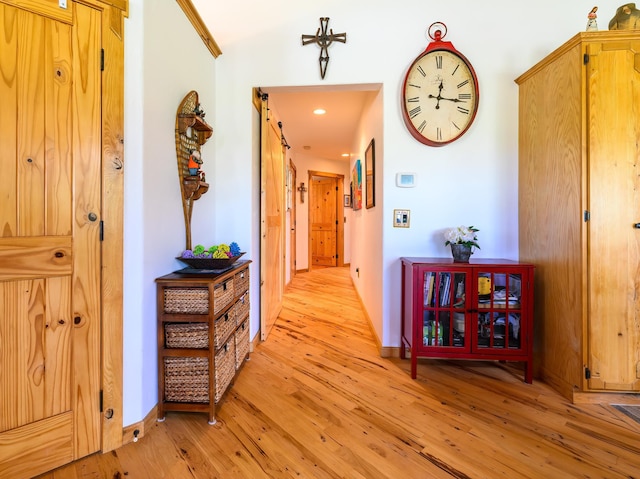 192 Leonard Ln, Eureka, MT 59917 - hallway with light wood-type flooring and a barn door