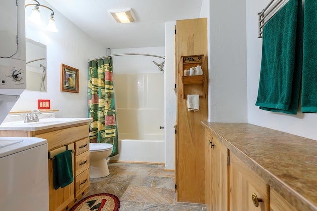 192 Leonard Ln, Eureka, MT 59917 - full bath featuring stacked washer / drying machine, stone finish flooring, vanity, and shower / bath combo