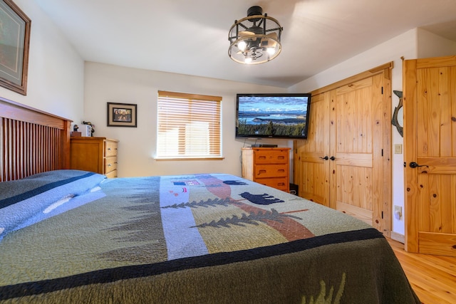 192 Leonard Ln, Eureka, MT 59917 - bedroom with wood finished floors and a chandelier