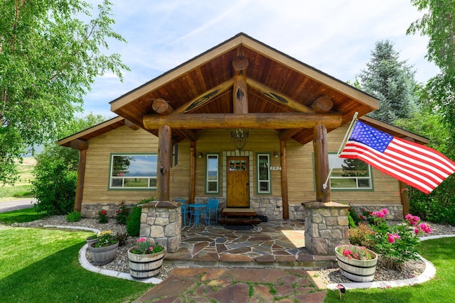 192 Leonard Ln, Eureka, MT 59917 - view of front of house with a porch and a front lawn