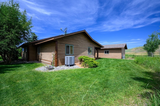 192 Leonard Ln, Eureka, MT 59917 - view of side of property with a cooling unit and a lawn