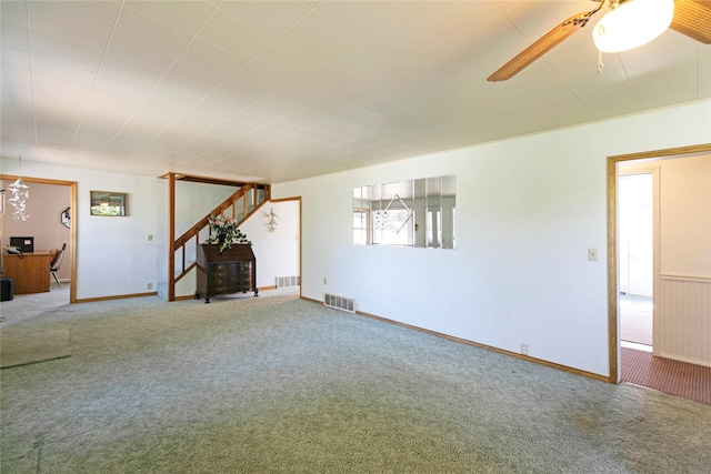232 Kurtz Ln, Hamilton, MT 59840 - unfurnished living room featuring stairway, carpet, and a ceiling fan