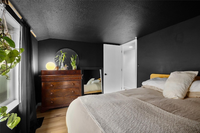 438 Somers Ave, Whitefish, MT 59937 - bedroom with wood finished floors and lofted ceiling