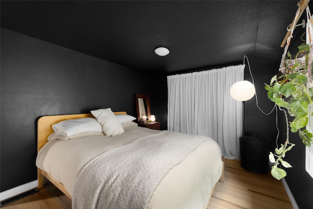 438 Somers Ave, Whitefish, MT 59937 - bedroom with wood finished floors and baseboards