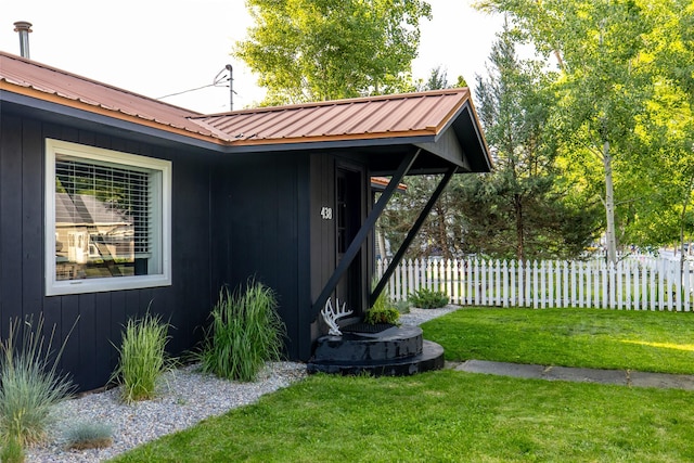 438 Somers Ave, Whitefish, MT 59937 - view of exterior entry featuring a metal roof and board and batten siding
