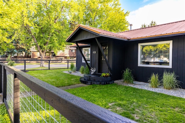 438 Somers Ave, Whitefish, MT 59937 - view of exterior entry with board and batten siding and a metal roof