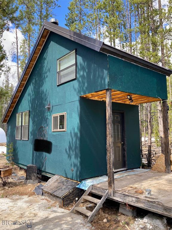 210 Grouse Hill Dr, Anaconda, MT 59711 - back of house featuring a wooden deck and stucco siding