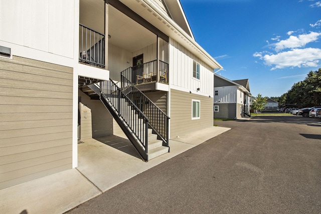 138 Jewel Basin Ct, Bigfork, MT 59911 - view of building exterior featuring stairs and a residential view