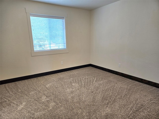 138 Jewel Basin Ct, Bigfork, MT 59911 - carpeted spare room with baseboards