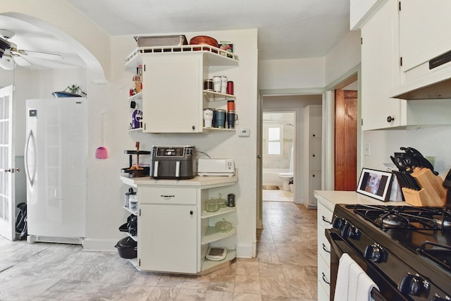 3120 1st Ave N, Great Falls, MT 59401 - kitchen featuring fridge, open shelves, black range with gas cooktop, light countertops, and a ceiling fan
