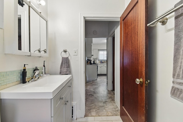 3120 1st Ave N, Great Falls, MT 59401 - bathroom featuring vanity and tasteful backsplash