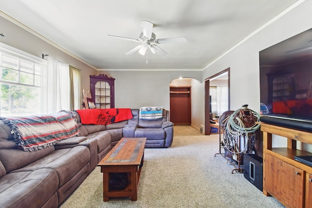 3120 1st Ave N, Great Falls, MT 59401 - living room featuring healthy amount of natural light, arched walkways, carpet, ceiling fan, and ornamental molding
