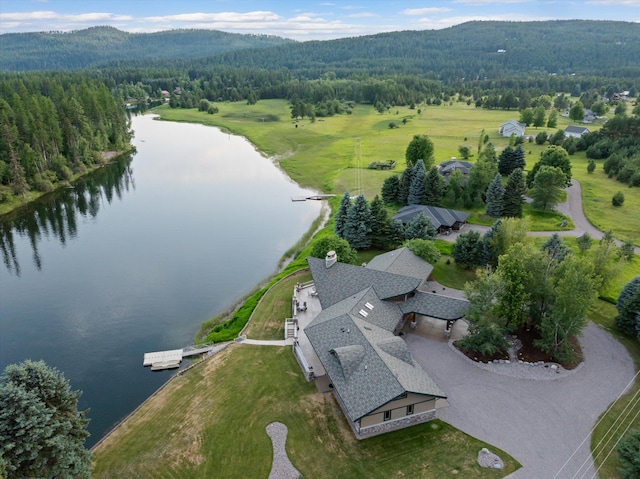 639 Three Eagle Ln, Bigfork, MT 59911 - aerial overview of property's location with a heavily wooded area and a water and mountain view